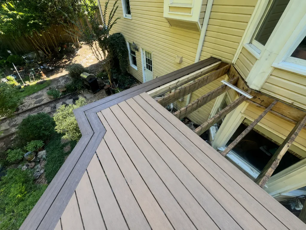 Two-tone composite deck installation with an angled picture-frame border in Indianapolis