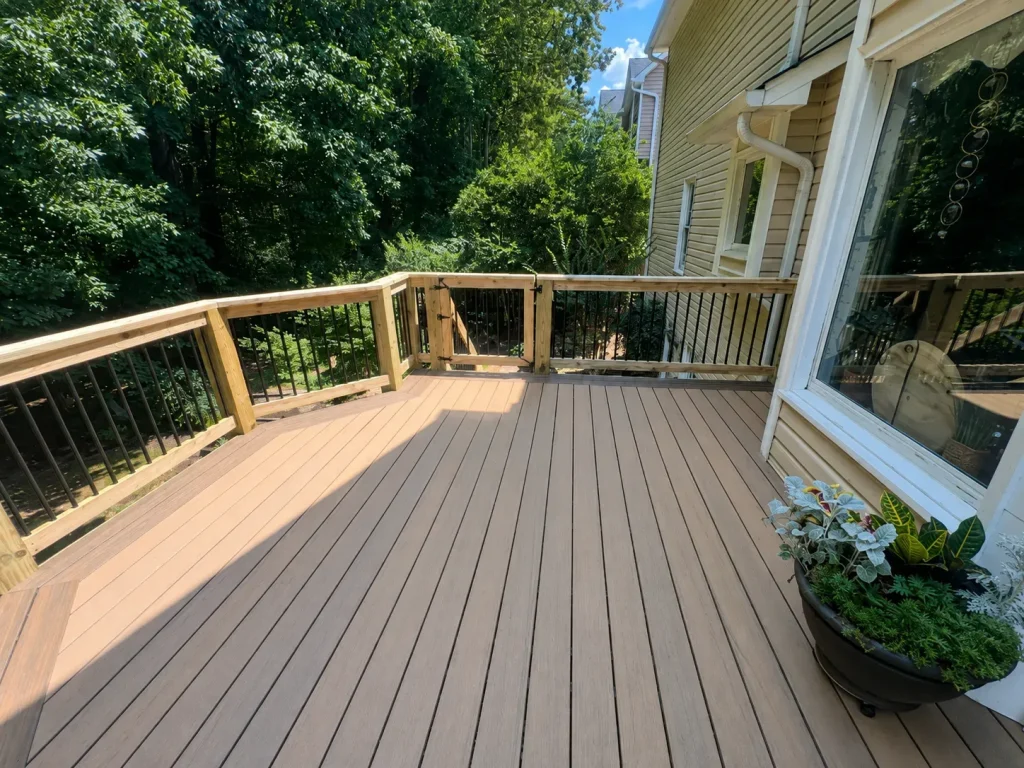 Finished composite deck with black railings and planters at an Indianapolis home