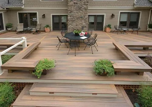 Large multi-level floating deck with built-in benches and dining area in Indianapolis