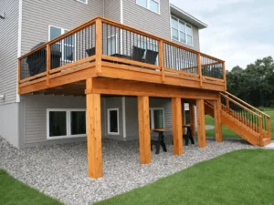 Elevated wood deck on support posts with black metal balusters at an Indianapolis home