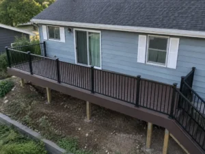 Elevated dark brown composite deck walkway with black railings at an Indianapolis home