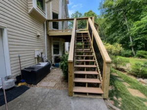 Elevated wood deck with long exterior staircase at an Indianapolis residence