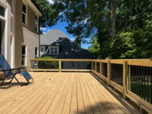 Spacious pressure-treated wood deck with black balusters at an Indianapolis residence